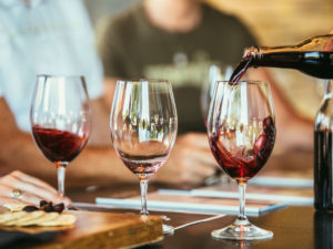 People drinking wine together at the bar Hohokus inn